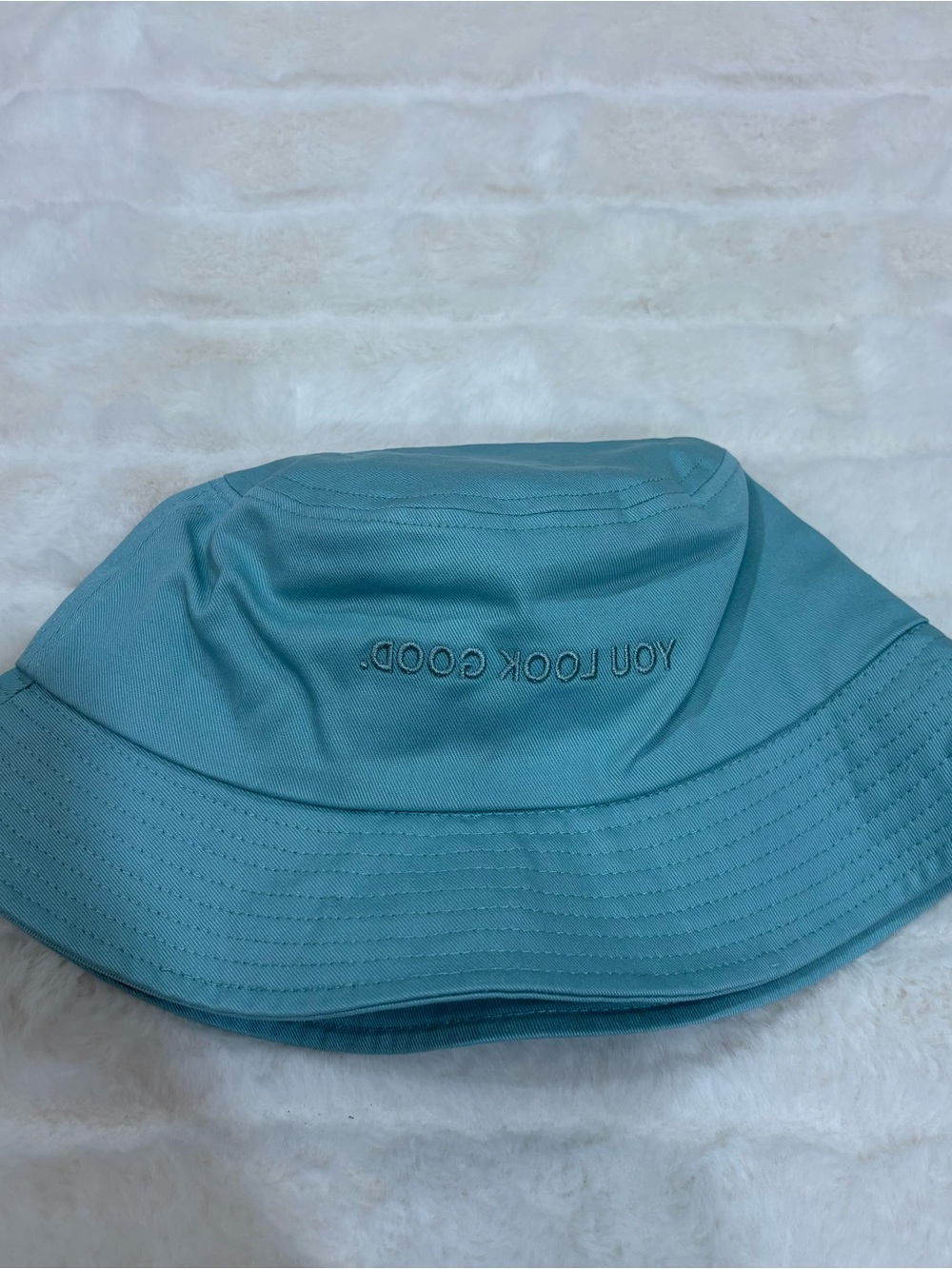 Glossier teal Bucket Hat with "YOU LOOK GOOD." Embroidery